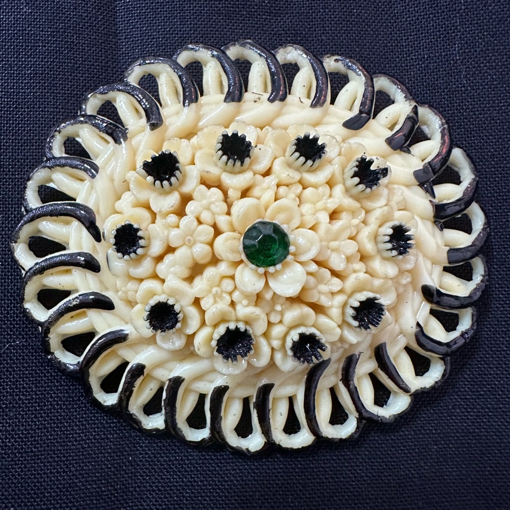 287- Celluloid Vtge. Floral Brooch Accent Emerald color Stones